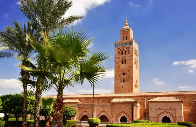 A stunning view of the mosque in Marrakech, Morocco, showcasing its intricate architecture and vibrant surroundings Marrakech Tours