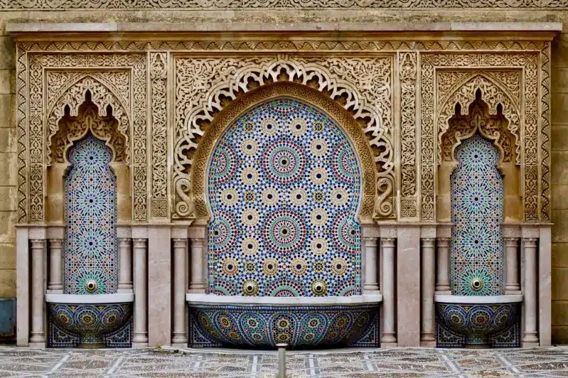 A stunning fountain adorned with intricate designs, showcasing the beauty of Moroccan heritage tours.