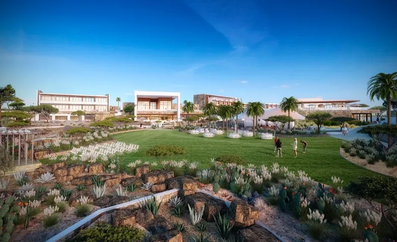 Scenic hillside resort featuring a vibrant green lawn, ideal for enjoying Agadir beach holidays and tranquil surroundings.