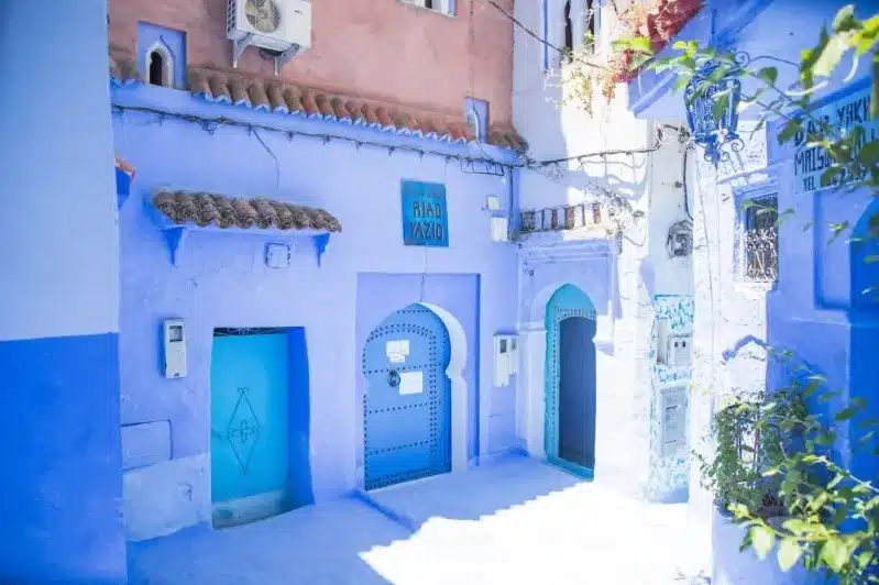 A picturesque blue house in Chefchaouen, morocco from south africa, showcasing the town's iconic blue architecture against a clear sky. 