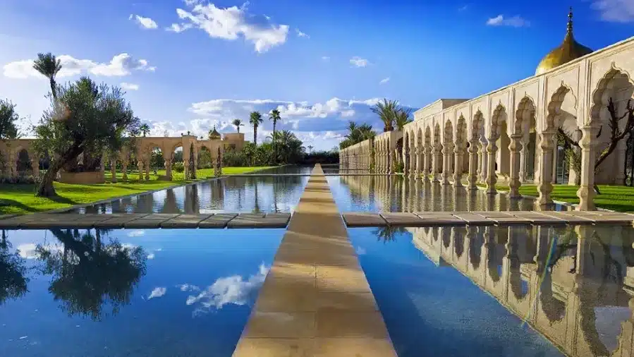 A serene view of the royal palace pool in Marrakech, showcasing its elegant design and tranquil surroundings.