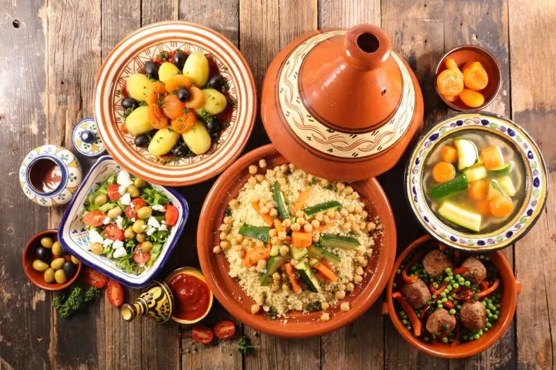A table adorned with a variety of exquisite dishes, showcasing the best food in Marrakech.