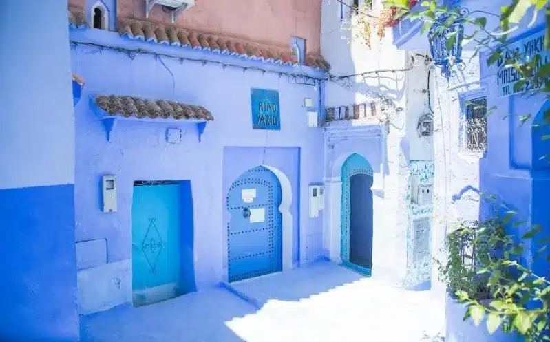 A scenic view of Chefchaouen, Morocco, showcasing its iconic blue buildings and vibrant cultural attractions. 