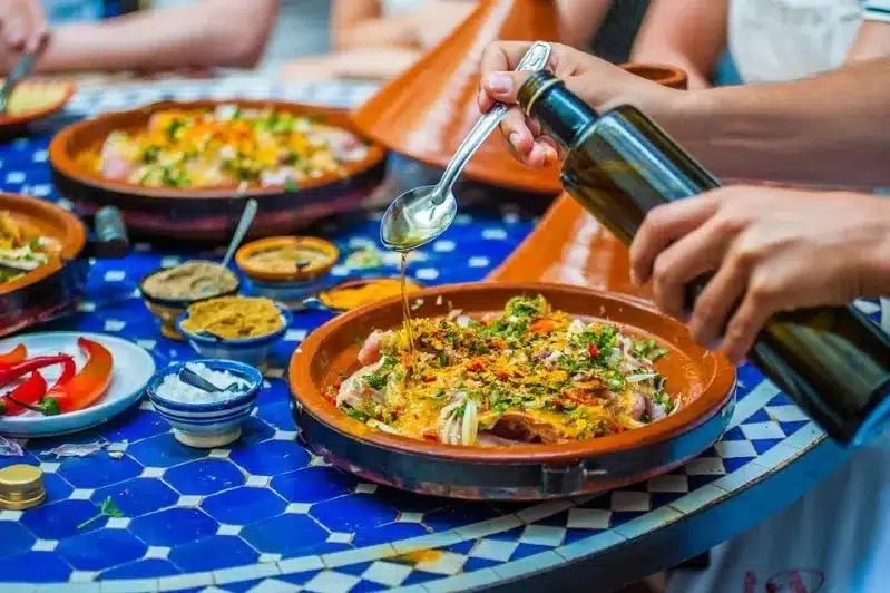 A beautifully arranged table filled with various Moroccan dishes, showcasing the culinary delights of the best Moroccan restaurant.