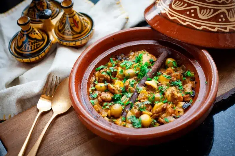 A vibrant Moroccan chicken and chickpea stew, showcasing rich spices and colorful ingredients, representing the best of Moroccan cuisine.