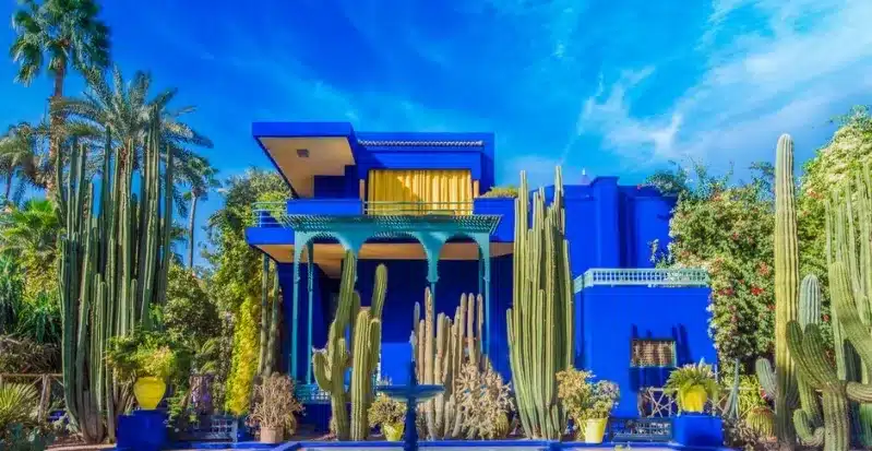 A vibrant blue house in Marrakech, Morocco, showcasing the city's unique architecture and charm during an All-Inclusive Trip to Morocco.