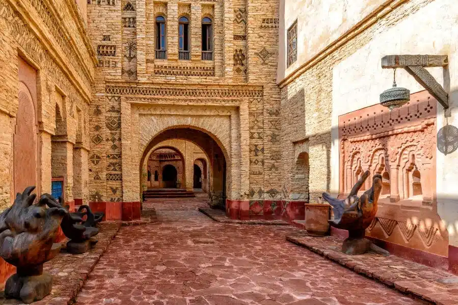 A scenic view of the Sultan of Morocco's palace courtyard, showcasing intricate architecture in Agadir, Morocco.