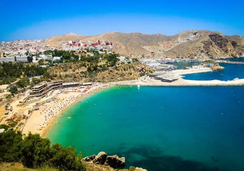 A scenic view of Almeria, Spain, showcasing its beach and town, ideal for travelers considering a trip to Morocco.