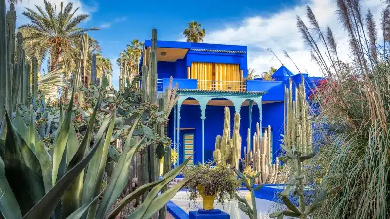 A picturesque blue house in Marrakech, Morocco, highlighting the city's appeal as one of the best places to visit.
