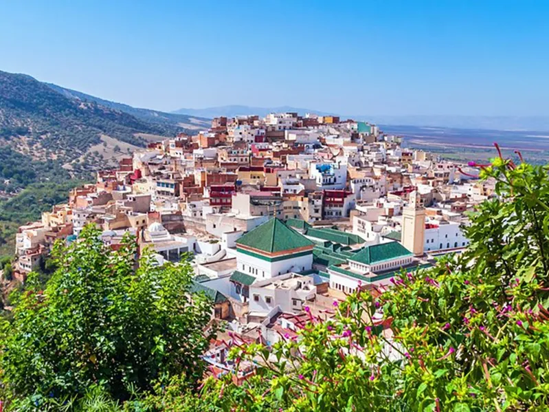 A panoramic view of Marrakech, Morocco, showcasing its vibrant architecture and bustling streets, ideal for travel enthusiasts.