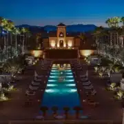 Exterior view of the luxurious Marriott Marrakech Hotel in Morocco, showcasing its elegant architecture and surrounding landscape.