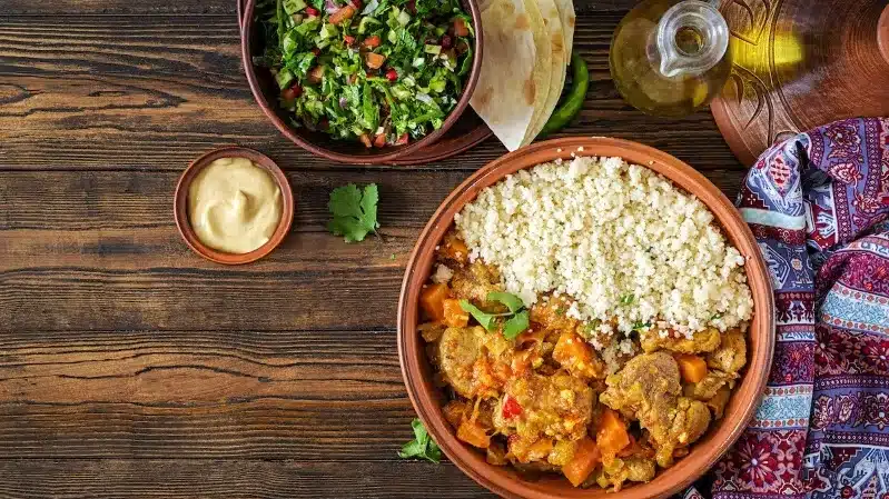 A delicious beef Moroccan tagine, showcasing the best Moroccan cuisine in London, served in a traditional clay pot.
