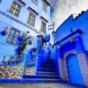 A picturesque street in Chefchaouen, Morocco, known for its vibrant blue architecture, a must-visit city in Morocco.