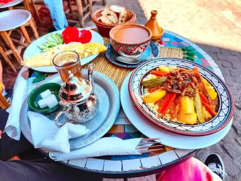 A table set with various Moroccan dishes and drinks, showcasing the local cuisine and culture. 