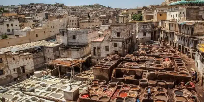 Scenic view of an old Moroccan city with traditional architecture and numerous pottery displays, perfect Morocco Tours for Seniors. 