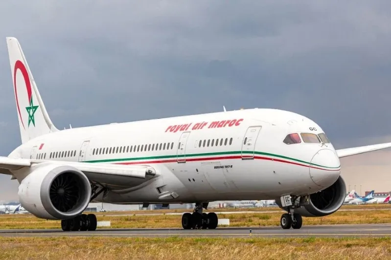 An morocan airplane on the runway at an airport, showcasing Air Morocco Safety branding.