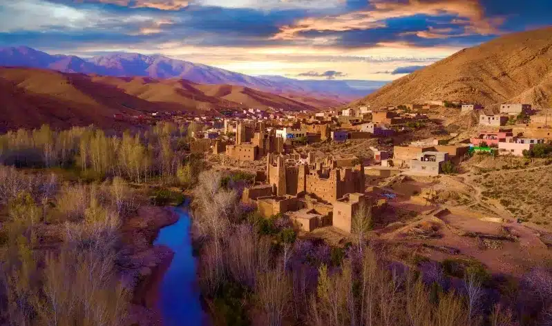 Scenic view of the village of Atlas in Morocco, showcasing its traditional architecture and surrounding mountains near Marrakech.