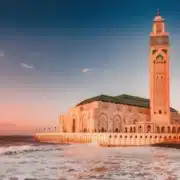 The grand mosque of Casablanca, a stunning architectural marvel, showcases intricate designs and a towering minaret.