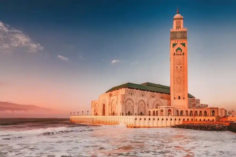 The grand mosque of Casablanca, a stunning architectural marvel, showcases intricate designs and a towering minaret.