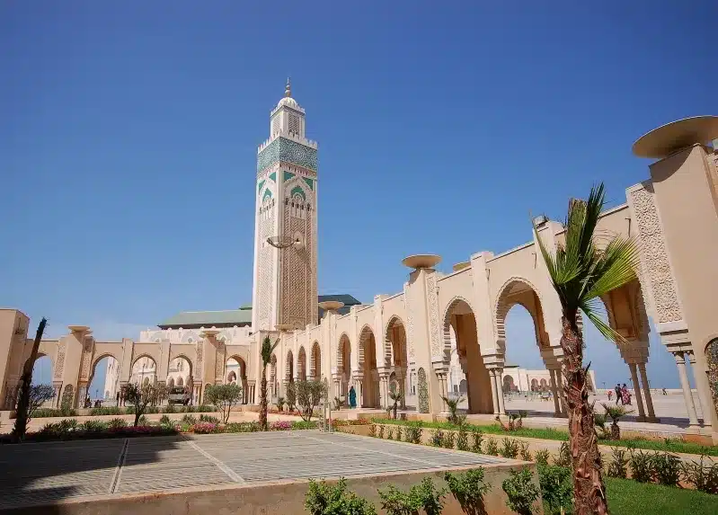 A mosque situated in the center of a large park, highlighting a places to visit in Morocco.