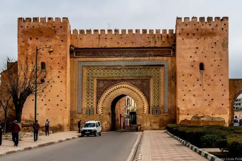 Entrance to Marrakech, showcasing vibrant architecture, a gateway to one best places to visit in Morocco.
