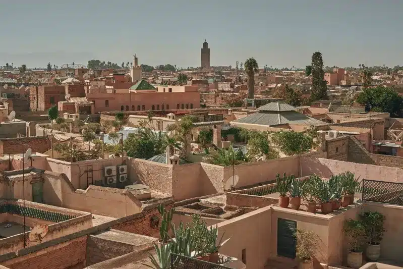 A panoramic view of Marrakech's rooftops, showcasing the vibrant architecture of one of Morocco's top tourist cities.