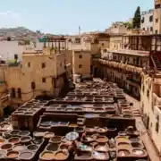 A vibrant market scene in Morocco showcasing an array of colorful pots and pans for sale.