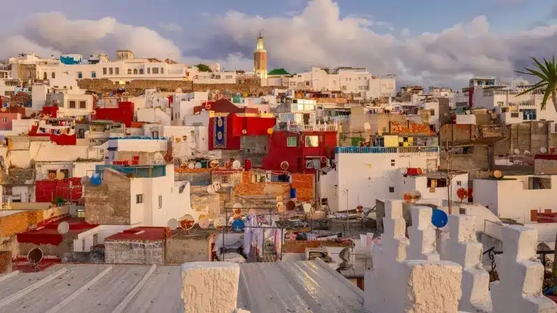 Colorful buildings in the city of Tunisia, showcasing vibrant architecture promoted by a Tangier travel agency.