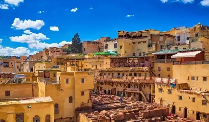 A panoramic view of Marrakech, Morocco, showcasing its vibrant architecture and bustling streets, a top travel destination.