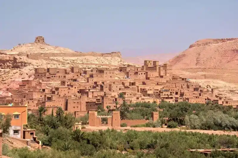 A panoramic view of the city of Atlas in Morocco, showcasing its unique architecture and surrounding landscapes.
