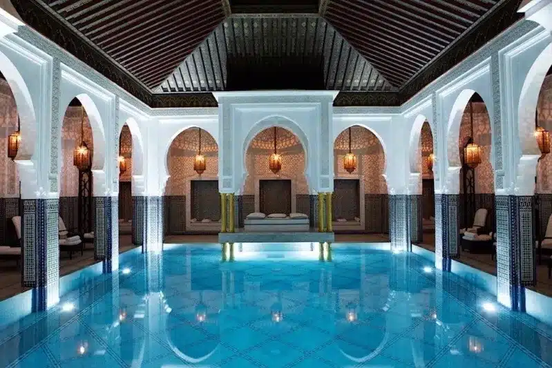  Indoor pool at Riad Marrakech, featuring traditional Moroccan architecture, ideal for relaxation during guided trips in Morocco.