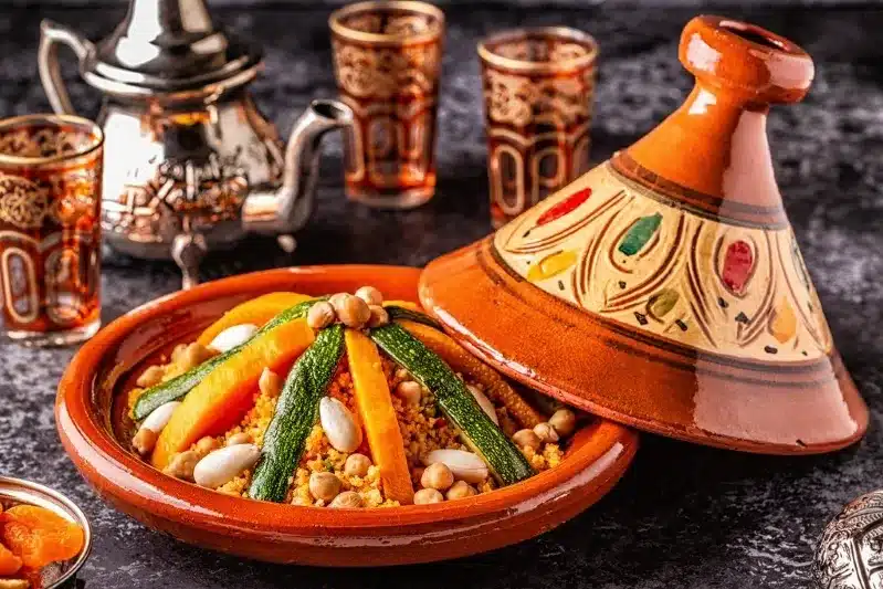 A clay pot filled with Moroccan rice and vegetables, showcasing vibrant colors and traditional culinary presentation.
