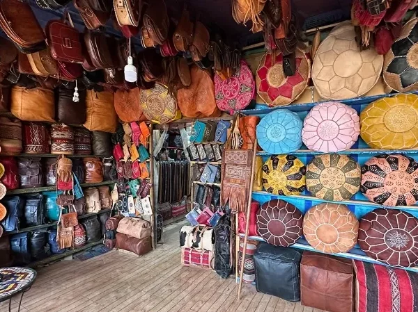 A vibrant store showcasing an array of colorful bags and purses during the Fes Medina Walking Tour.