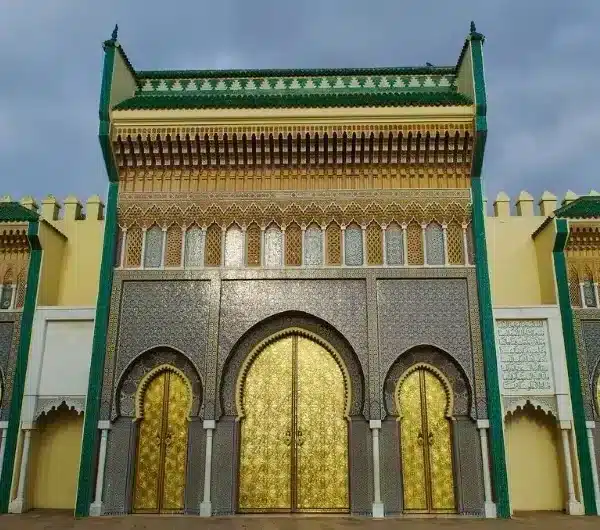 Entrance to the Moroccan king's palace, showcasing intricate architecture during a Rabat Day Tour.