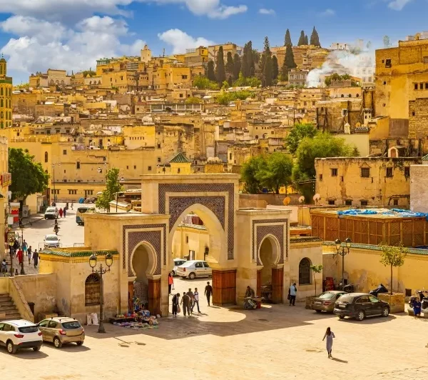 A panoramic view of Marrakech, Morocco, showcasing its vibrant architecture and bustling streets during a 6-day tour from Casablanca.