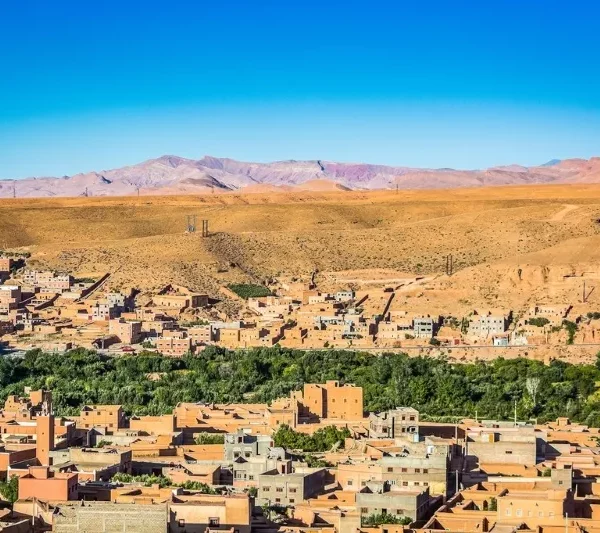A panoramic view of the city of Atlas in Morocco, showcasing its unique architecture and surrounding landscapes.
