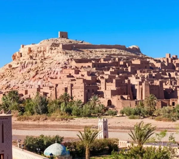 Scenic view of Morocco's city, desert, and mountains, highlighting a 9-day tour from Marrakech.
