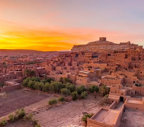 Sunset over the Moroccan desert, showcasing vibrant colors during a 3-day Casablanca tour.