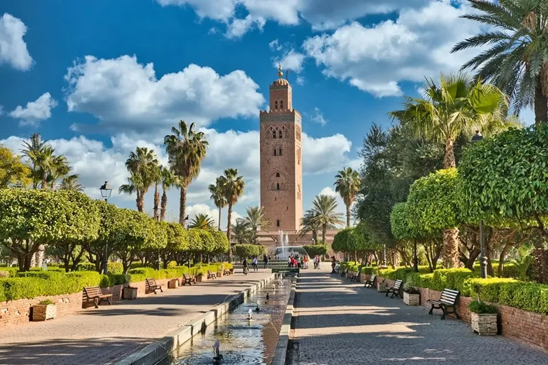 Clock tower of the Marrakech mosque in Morocco, a highlight for solo travelers exploring the city's rich culture.