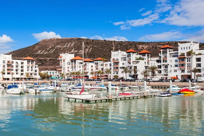The marina in Agadir, Morocco, showcasing boats and the vibrant coastal scenery.