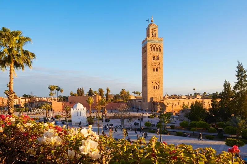 The cityscape of Marrakech, Morocco, featuring colorful buildings and lively markets, perfect for exploring Morocco Travel Tips.