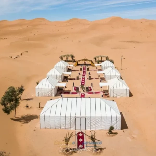 Aerial view of a desert wedding venue, showcasing the arid landscape and setup for a romantic ceremony.