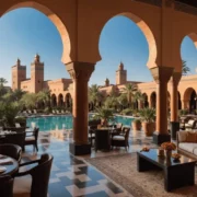 Luxurious courtyard with elegant arches, a central pool, and lush greenery. Inviting seating areas create a warm, serene ambiance under a clear blue sky.