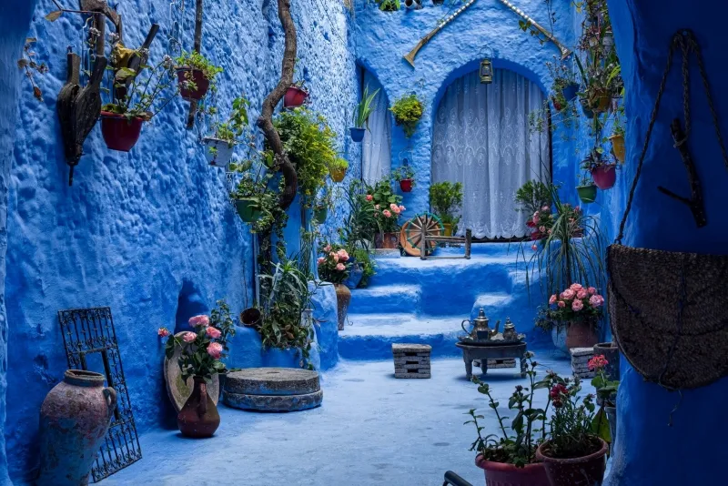 chefchaouen Scenic view of Chefchaouen, Morocco, showcasing its iconic blue buildings and mountainous backdrop.