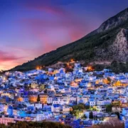 Scenic view of Chefchaouen, Morocco, showcasing its iconic blue buildings and mountainous backdrop.