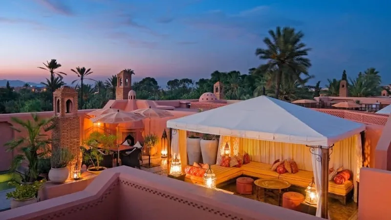 Luxury hotel in Marrakech, Morocco, showcasing opulent architecture and inviting ambiance, ideal for visits in spring and fall.